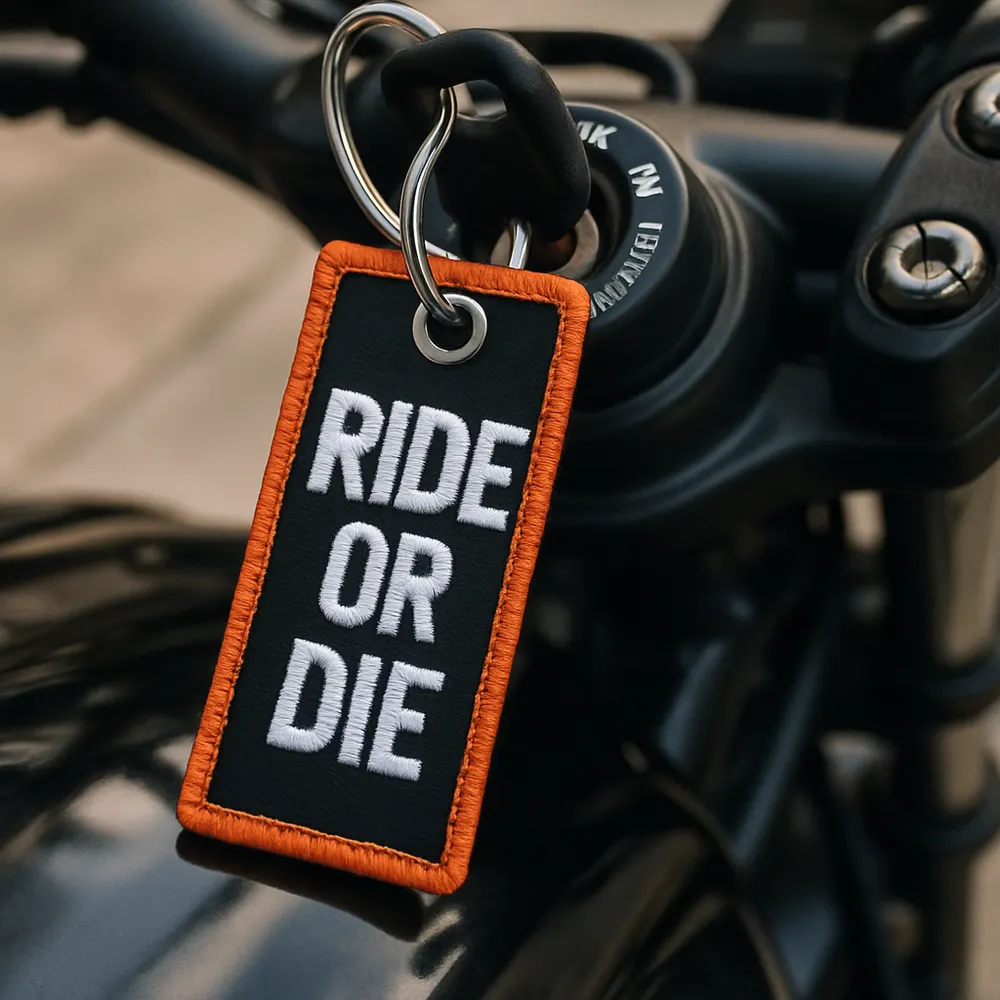 MyMotoTag keychain hanging from a motorcycle ignition